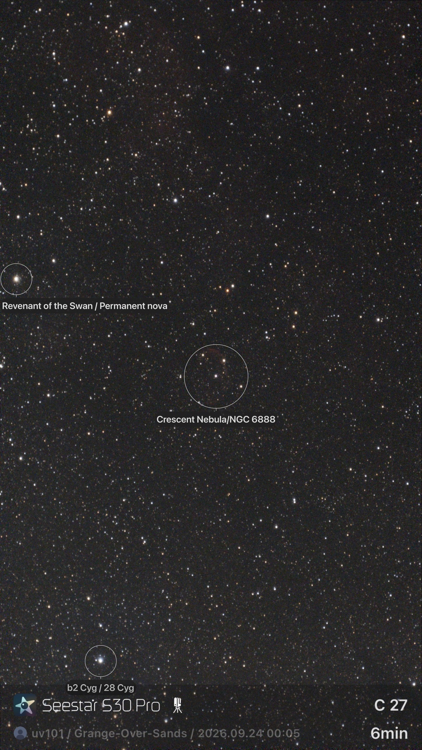 Dense star field in Cygnus with the faint red outline of the Crescent Nebula circled by the app
